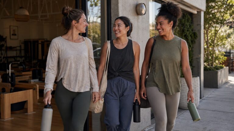 Women wearing natural fiber activewear tops after a low-sweat Pilates session